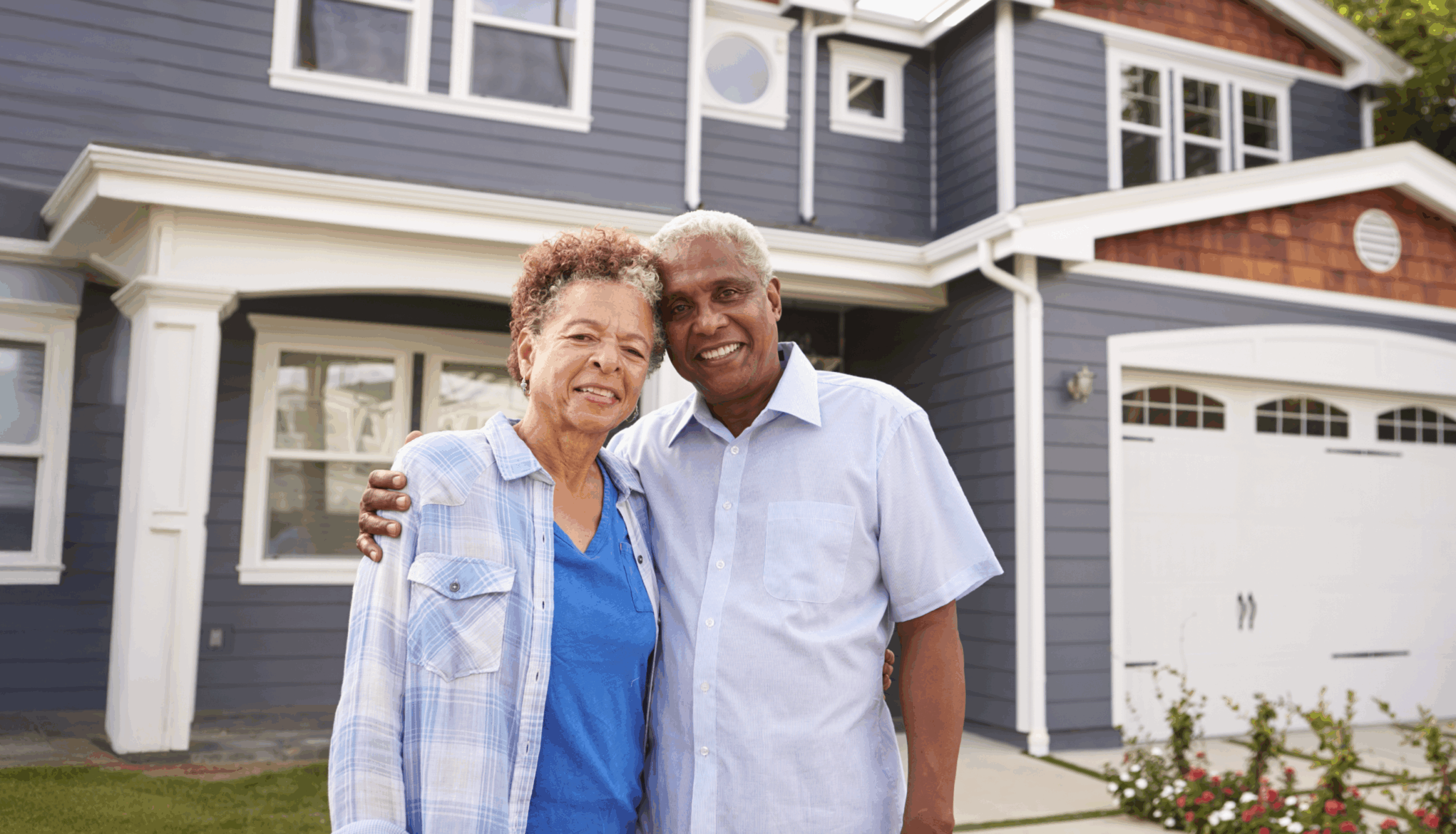 bill & mary in front of home